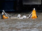 An object floats at the scene of a helicopter crash on the Hudson River near lower Manhattan in New York, as seen from Newport, New Jersey, U.S., April 10, 2025. 