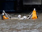 An object floats at the scene of a helicopter crash on the Hudson River near lower Manhattan in New York, as seen from Newport, New Jersey, U.S., April 10, 2025.  REUTERS/Eduardo Munoz