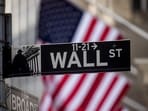 A Wall Street sign in front of the New York Stock Exchange (NYSE) in New York, US, on Thursday, April 10, 2025. Risk appetites vanished on Wall Street after the biggest burst of buying in years, with stocks falling even after subdued inflation data extended a bounce in Treasuries. Photographer: Michael Nagle/Bloomberg
