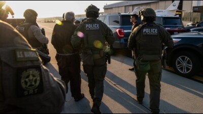 A US Department of Justice (DoJ) photo of the handover. (DoJ) A US Department of Justice (DoJ) photo of the handover. (DoJ)