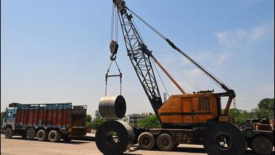 A crane loads steel coils onto a truck at a railway yard in Chandigarh on April 3. (AFP FILE PHOTO) A crane loads steel coils onto a truck at a railway yard in Chandigarh on April 3. (AFP FILE PHOTO)