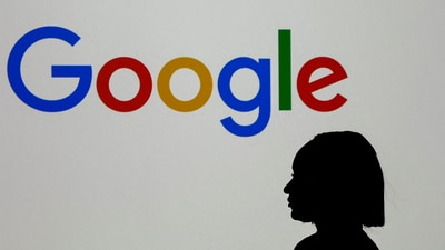 A woman stands in front of a Google logo during a media reception at the Google France headquarters ahead of the Artificial Intelligence Action Summit in Paris, France, February 9, 2025. (Gonzalo Fuentes/Reuters)