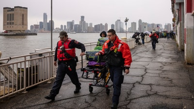 The New York City Fire Department (FDNY) personnels carry a stretcher at Pier 40, where a helicopter went down in the Hudson River between Manhattan and the New Jersey waterfront, Thursday, April 10, 2025, in New York. (AP Photo/Yuki Iwamura) (AP) The New York City Fire Department (FDNY) personnels carry a stretcher at Pier 40, where a helicopter went down in the Hudson River between Manhattan and the New Jersey waterfront, Thursday, April 10, 2025, in New York. (AP Photo/Yuki Iwamura) (AP)