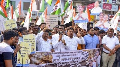 TMC members take out a protest rally demanding the reinstatement of qualified teachers, in Malda, West Bengal. (PTI) TMC members take out a protest rally demanding the reinstatement of qualified teachers, in Malda, West Bengal. (PTI)