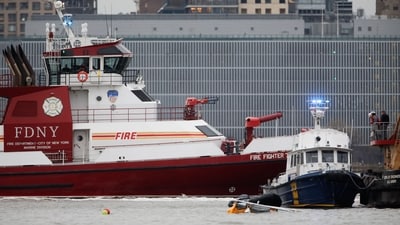First responders (R) are seen near the landing skids of a helicopter (foreground, in water) after it crashed into the Hudson River, in the Newport neighborhood of Jersey City, New Jersey, on April 10, 2025. Six people including three children were killed after a sightseeing helicopter crashed into the Hudson River in New York on Thursday, sparking a major water rescue operation, authorities said. The crash killed all those onboard the aircraft: the pilot and a family from Spain. Two of the victims were initially taken to a hospital, but later succumbed to their injuries. (Photo by Leonardo Munoz / AFP) (AFP) First responders (R) are seen near the landing skids of a helicopter (foreground, in water) after it crashed into the Hudson River, in the Newport neighborhood of Jersey City, New Jersey, on April 10, 2025. Six people including three children were killed after a sightseeing helicopter crashed into the Hudson River in New York on Thursday, sparking a major water rescue operation, authorities said. The crash killed all those onboard the aircraft: the pilot and a family from Spain. Two of the victims were initially taken to a hospital, but later succumbed to their injuries. (Photo by Leonardo Munoz / AFP) (AFP)