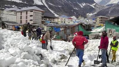 Workers remove snow near the Kedarnath Temple for the upcoming ‘Char Dham Yatra’ in Rudraprayag district, Uttarakhand on April 5 (PTI FILE PHOTO) Workers remove snow near the Kedarnath Temple for the upcoming ‘Char Dham Yatra’ in Rudraprayag district, Uttarakhand on April 5 (PTI FILE PHOTO)