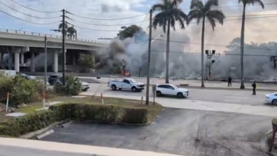 Authorities are present at the scene as the small plane crashed near a major highway in South Florida. (Screengrab/X/@_TruthZone_) Authorities are present at the scene as the small plane crashed near a major highway in South Florida. (Screengrab/X/@_TruthZone_)