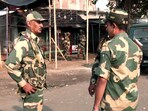 Security personnel stand guard after violent protests against the Waqf (Amendment) Act, at Dhuliyan in Murshidabad on Saturday. Three people killed in the violent protests. 