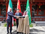 Iranian Foreign Minister Hossein Amir-Abdollahian and Saudi Arabia's Foreign Minister Prince Faisal bin Farhan Al Saud and Chinese Foreign Minister Qin Gang shake hands during a meeting in Beijing, China, April 6, 2023. Iran's Foreign Ministry/WANA (West Asia News Agency)/Handout via REUTERS 