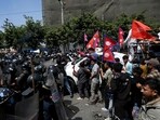 Pro-monarchy demonstrators scuffle with Nepal police during a protest to demand a Hindu state, in Kathmandu