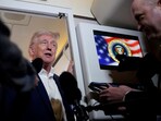 U.S. President Donald Trump talks to the media on board Air Force One on the way to Palm Beach International Airport