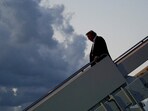 U.S. President Donald Trump disembarks Air Force One at Palm Beach International Airport, West Palm Beach, Florida, U.S., April 11, 2025. REUTERS/Nathan Howard