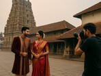 A couple posing for a picture at Udupi's Sri Krishna temple premises (AI-generated image for representation) 