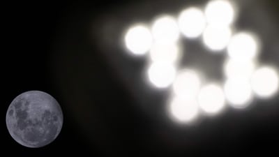 A streetlight glows as the full moon rises over Kiama Surf Beach, about 120 kilometres south of Sydney, on April 12, 2025. (AFP) A streetlight glows as the full moon rises over Kiama Surf Beach, about 120 kilometres south of Sydney, on April 12, 2025. (AFP)