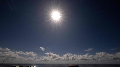 This photograph, taken with a long exposure time on April 12, 2025, shows a full moon rising in a cloudy sky over Kiama Surf Beach, about 120 kilometres south of Sydney. (AFP) This photograph, taken with a long exposure time on April 12, 2025, shows a full moon rising in a cloudy sky over Kiama Surf Beach, about 120 kilometres south of Sydney. (AFP)