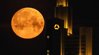 The spring's first full moon, also known as "Pink Moon", is seen behind the headquarters of Commerzbank bank in the banking district of Frankfurt am Main, western Germany on April 12, 2025. (AFP) The spring's first full moon, also known as "Pink Moon", is seen behind the headquarters of Commerzbank bank in the banking district of Frankfurt am Main, western Germany on April 12, 2025. (AFP)