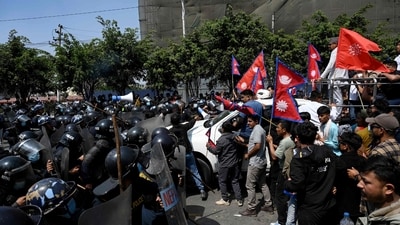 Pro-monarchy demonstrators scuffle with Nepal police during a protest to demand a Hindu state, in Kathmandu (AFP) Pro-monarchy demonstrators scuffle with Nepal police during a protest to demand a Hindu state, in Kathmandu (AFP)