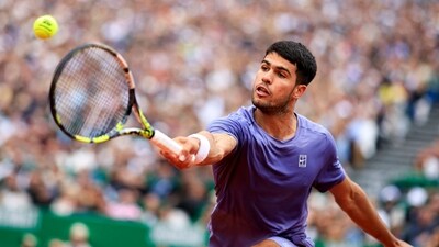 Spain's Carlos Alcaraz plays a backhand return (AFP) Spain's Carlos Alcaraz plays a backhand return (AFP)