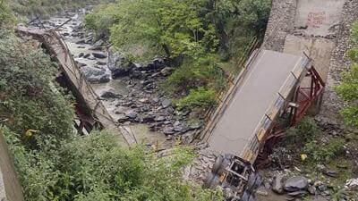 The concrete bridge that collapsed at Mangalore in Banjar valley of Kullu on Saturday, April 12, 2025. The incident took place when a truck carrying cement was crossing the bridge. (PTI)