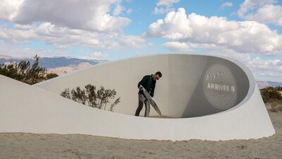 Visitors look at French-American artist Sarah Meyohas' piece “Truth Arrives in Slanted Beams,” (Photo by Valerie MACON / AFP) (AFP) Visitors look at French-American artist Sarah Meyohas' piece “Truth Arrives in Slanted Beams,” (Photo by Valerie MACON / AFP) (AFP)