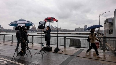 A news team is seen outside the Downtown Skyport, one of the places from which helicopter excursions leave New York City. (Photo by SPENCER PLATT / GETTY IMAGES NORTH AMERICA / Getty Images via AFP) (Getty Images via AFP) A news team is seen outside the Downtown Skyport, one of the places from which helicopter excursions leave New York City. (Photo by SPENCER PLATT / GETTY IMAGES NORTH AMERICA / Getty Images via AFP) (Getty Images via AFP)