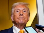 US President Donald Trump addresses the media on board Air Force One.