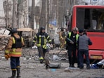 Rescuers attempt to clear the damage in Ukraine after two Russian missiles struck Sumy city.
