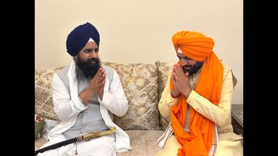 Akal Takht officiating jathedar Giani Kuldeep Singh Gargaj with Haryana chief minister Nayab Singh Saini in Anandpur Sahib on Sunday. (HT photo)