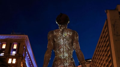 The sculpture R-Evolution, a 45-foot-tall sculpture of a naked woman by artist Marco Cochrane, faces looking up Market Street after it was unveiled at Justin Herman Plaza in San Francisco, on Thursday, April 10, 2025. (Carlos Avila Gonzalez/San Francisco Chronicle via AP) (AP) The sculpture R-Evolution, a 45-foot-tall sculpture of a naked woman by artist Marco Cochrane, faces looking up Market Street after it was unveiled at Justin Herman Plaza in San Francisco, on Thursday, April 10, 2025. (Carlos Avila Gonzalez/San Francisco Chronicle via AP) (AP)