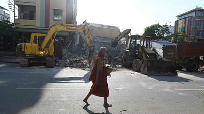 A Buddhist monk walks past the debris of a damaged pagoda in Mandalay on April 13, 2025, following the devastating earthquake in Myanmar. (AFP) A Buddhist monk walks past the debris of a damaged pagoda in Mandalay on April 13, 2025, following the devastating earthquake in Myanmar. (AFP)