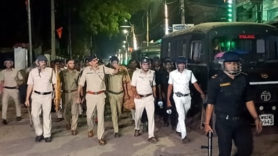 Police and security personnel keep a vigil at an area amid protests over the Waqf (Amendment) Act, in Murshidabad district, West Bengal, Saturday, April 12, 2025. (PTI)