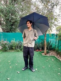Some students have taken to the good old umbrella to shield themselves from the bright sun. Some students have taken to the good old umbrella to shield themselves from the bright sun.