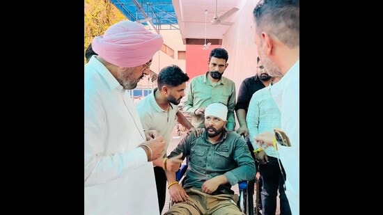 Dera Bassi AAP MLA Kuljit Singh Randhawa visited the sarpanch’s husband and other injured AAP supporters on Sunday. (HT)