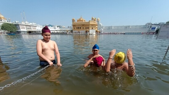 At the sarovar of Golden Temple too, devotees take dip before going for prayers.(HT/Sant Arora )