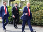 US President Donald Trump and Vice President JD Vance walk to welcome the Ohio State University 2025 College Football National Champions, at the White House, in Washington, D.C., U.S., April 14, 2025.