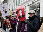 Demonstrators protest against Tesla CEO Elon Musk outside a Tesla dealership in the Georgetown neighborhood of Washington, D.C., U.S., April 12, 2025. REUTERS/Annabelle Gordon