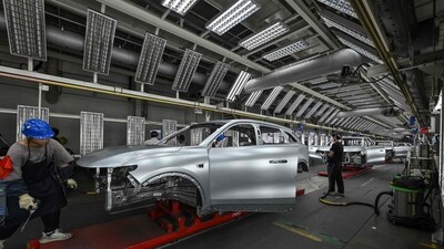Employees work on an electric vehicle (EV) production line
in eastern China's Zhejiang province on September 18, 2024.
(Photo by Adek BERRY / AFP) (AFP) Employees work on an electric vehicle (EV) production line
in eastern China's Zhejiang province on September 18, 2024.
(Photo by Adek BERRY / AFP) (AFP)