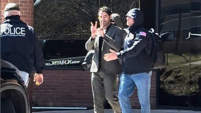 Mohsen Mahdawi being detained at the U.S. Citizenship and Immigration Services office in Colchester. (AP) Mohsen Mahdawi being detained at the U.S. Citizenship and Immigration Services office in Colchester. (AP)