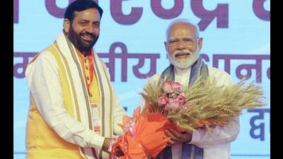Prime Minister Narendra Modi being felicitated by Haryana chief minister Nayab Singh Saini at the event to mark the launch of multiple projects in the state, in Hisar on Monday. (HT Photo)