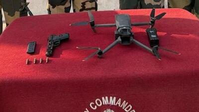 The drone and weapon seized by BSF