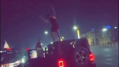 The video shows a man dancing atop the Mahindra Thar car, while four of his friends stand nearby. HT, however, could not verify the authenticity of the video. (HT Photo (video grab)) The video shows a man dancing atop the Mahindra Thar car, while four of his friends stand nearby. HT, however, could not verify the authenticity of the video. (HT Photo (video grab))