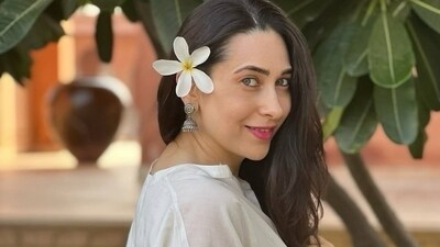 Karisma Kapoor dazzles in a white cotton tunic kurta and pants. Karisma Kapoor dazzles in a white cotton tunic kurta and pants.