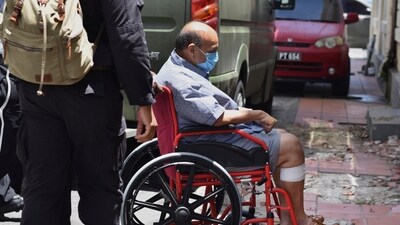 File photo of Mehul Choksi being taken in a wheelchair to the magistrate's court by police after his arrest for illegal entry into Dominica, in Roseau on June 4, 2021. (AP Photo) File photo of Mehul Choksi being taken in a wheelchair to the magistrate's court by police after his arrest for illegal entry into Dominica, in Roseau on June 4, 2021. (AP Photo)