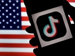 In this photo illustration, the social media application logo, TikTok is displayed on the screen of an iPhone on an American flag background on August 3, 2020 in Arlington, Virginia.