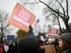 Demonstrators rally, calling on Harvard leadership to resist interference at the university by the federal government.