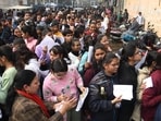 Aspirants standing in queue before appearing in the JEE Mains exam at an examination centre in Patna.