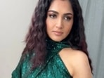 Khushbu Sundar posted pictures in a green sequinned dress on social media, only to receive criticism from a troll. 