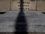 FILE PHOTO: A sign is seen at the U.S. Internal Revenue Service (IRS) building after it was reported the IRS will lay off about 6,700 employees, a restructuring that could strain the tax-collecting agency's resources during the critical tax-filing season, in Washington, D.C., February 20, 2025. REUTERS/Kent Nishimura/File Photo