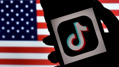 In this photo illustration, the social media application logo, TikTok is displayed on the screen of an iPhone on an American flag background on August 3, 2020 in Arlington, Virginia. (AFP) In this photo illustration, the social media application logo, TikTok is displayed on the screen of an iPhone on an American flag background on August 3, 2020 in Arlington, Virginia. (AFP)