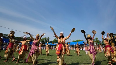 On Bohag Bihu, the Assamese New Year officially begins. It is a festival honouring farmers with a strong agricultural foundation. Mesha Sankranti marks the start of the week-long festivities. In pic: Assamese girls wearing traditional dresses perform the classical Satriya dance during the Rongali Bihu festival, organised by All Assam Students Union in Guwahati, capital of the north eastern state of Assam, India, (AP) On Bohag Bihu, the Assamese New Year officially begins. It is a festival honouring farmers with a strong agricultural foundation. Mesha Sankranti marks the start of the week-long festivities. In pic: Assamese girls wearing traditional dresses perform the classical Satriya dance during the Rongali Bihu festival, organised by All Assam Students Union in Guwahati, capital of the north eastern state of Assam, India, (AP)